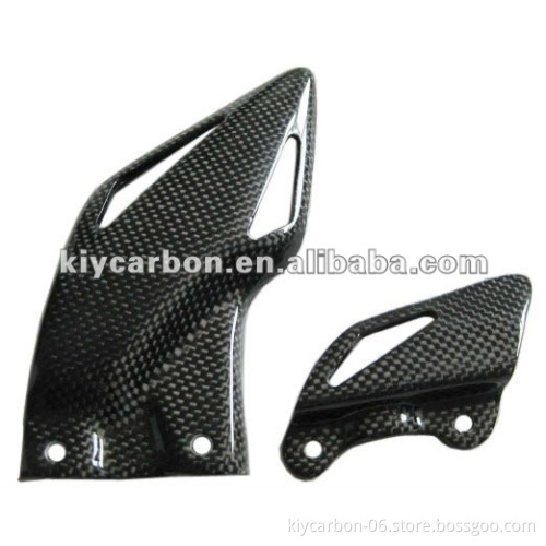 Carbon fiber heel guards for motorcycles